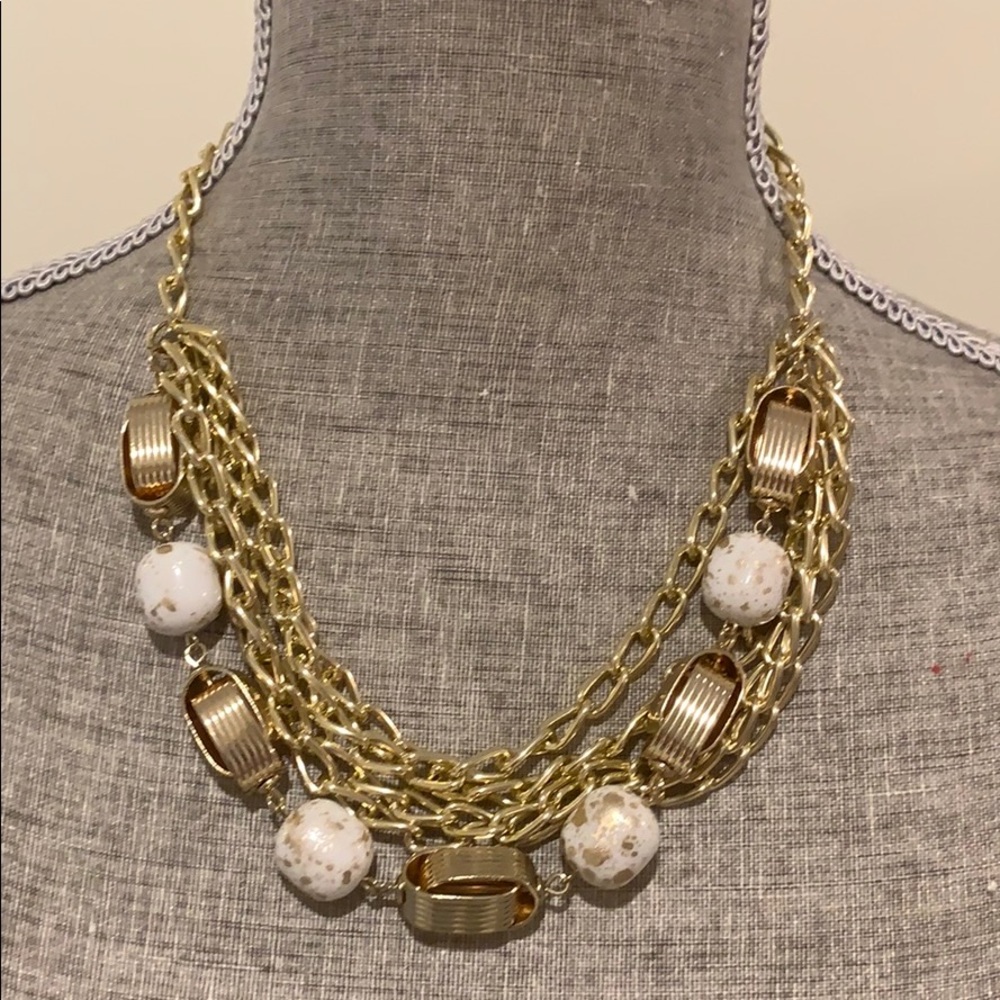 Multi chain statement necklace white and gold